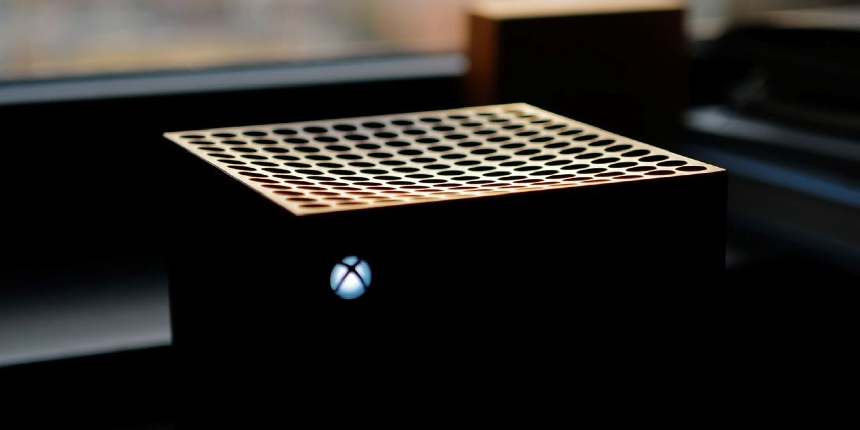A close up photograph of the top half of an Xbox Series X console