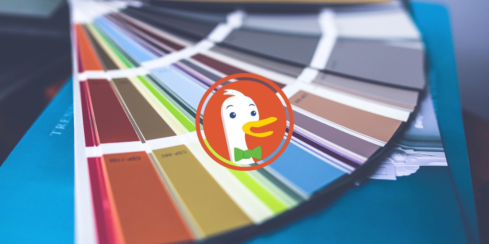An image of the DuckDuckGo logo in the center with a color palette background