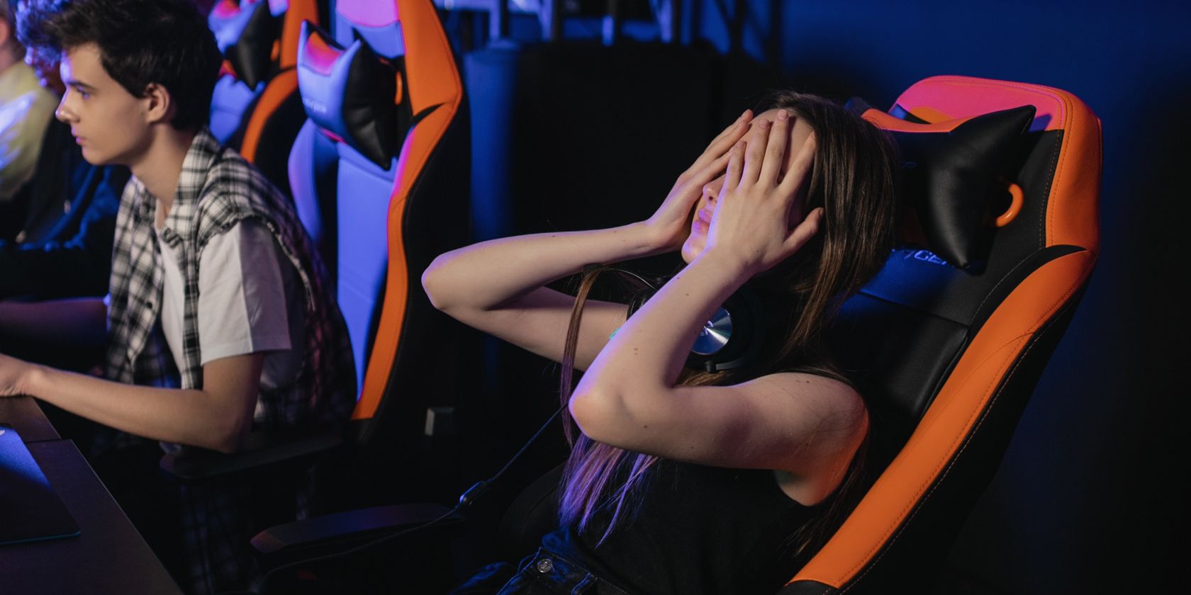 Frustrated gamer girl on gaming chair