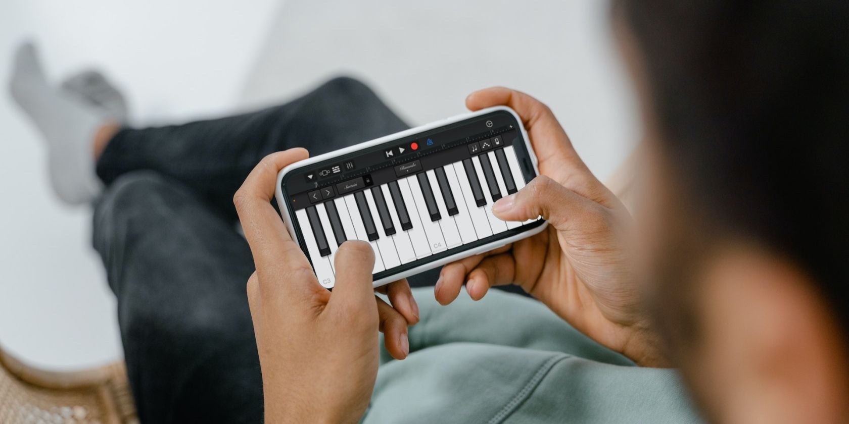 person using GarageBand on an iPhone
