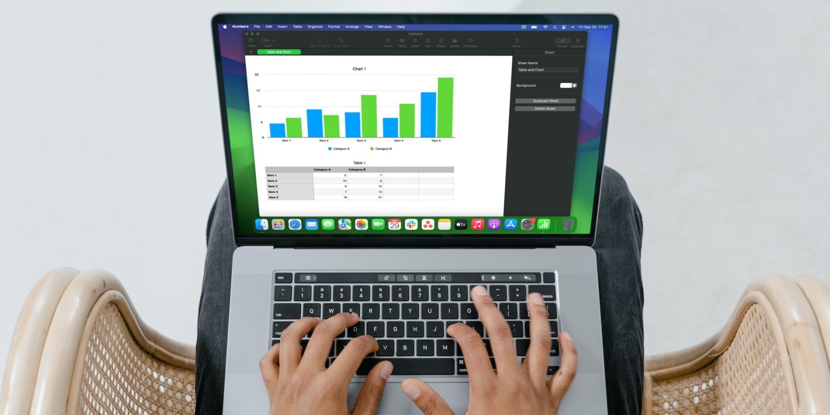 person using Numbers on a MacBook