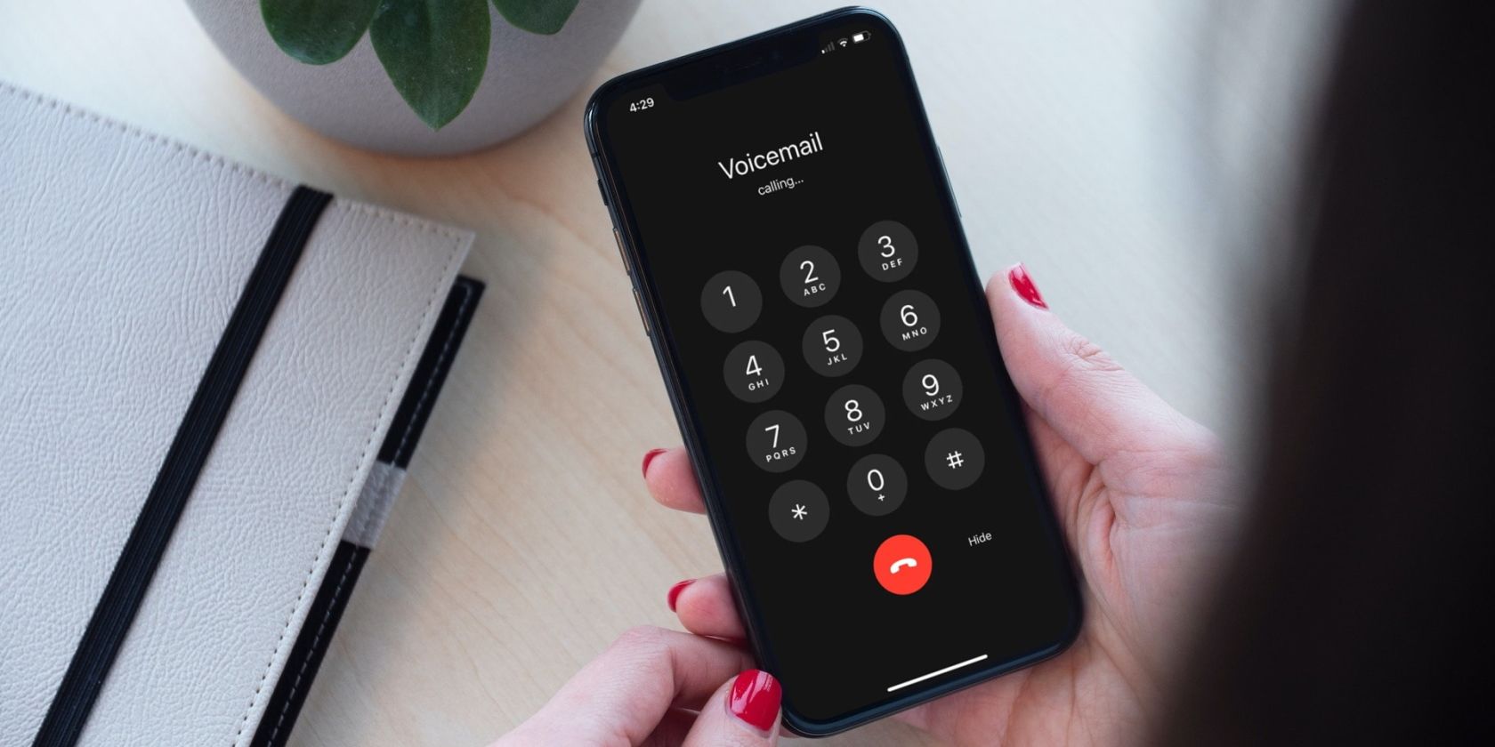 person using voicemail on an iPhone