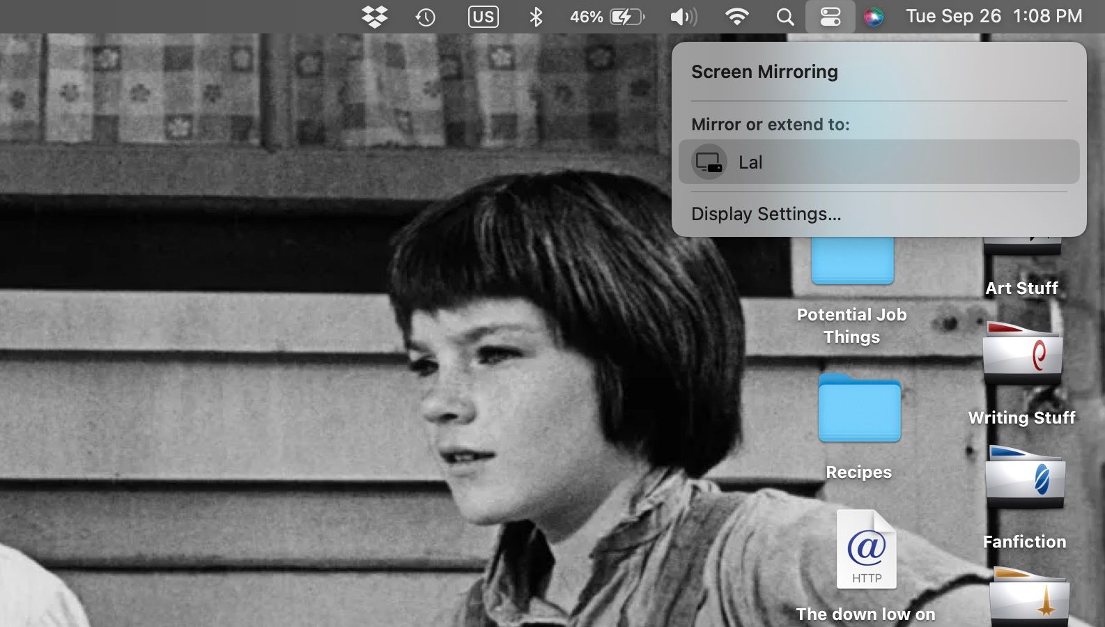 Screen Mirroring menu open on MacBook Pro, showing Roku device