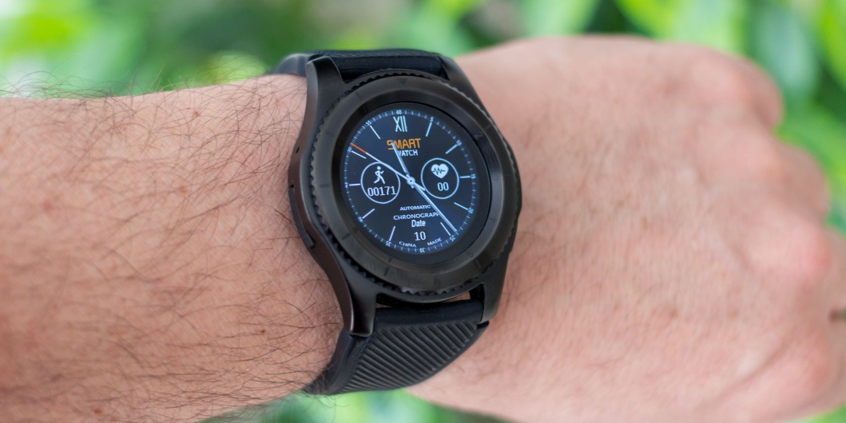 Smartwatch being worn on a hairy armed person