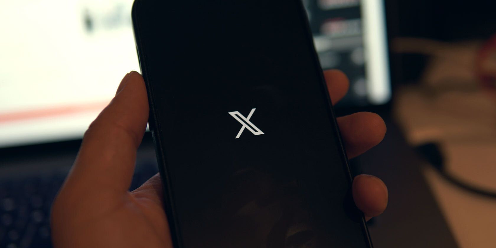 the x twitter logo on a smartphone