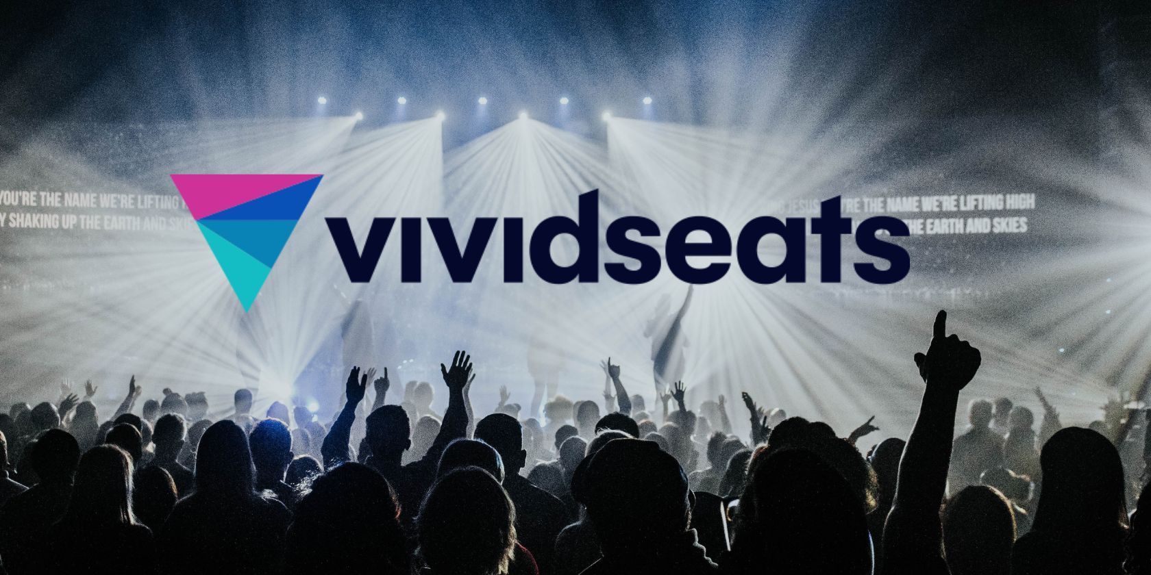 vivid seats logo in front of concert and crowd dancing