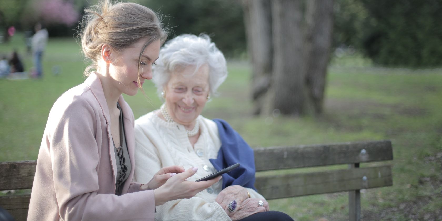 young woman and old woman using a phone