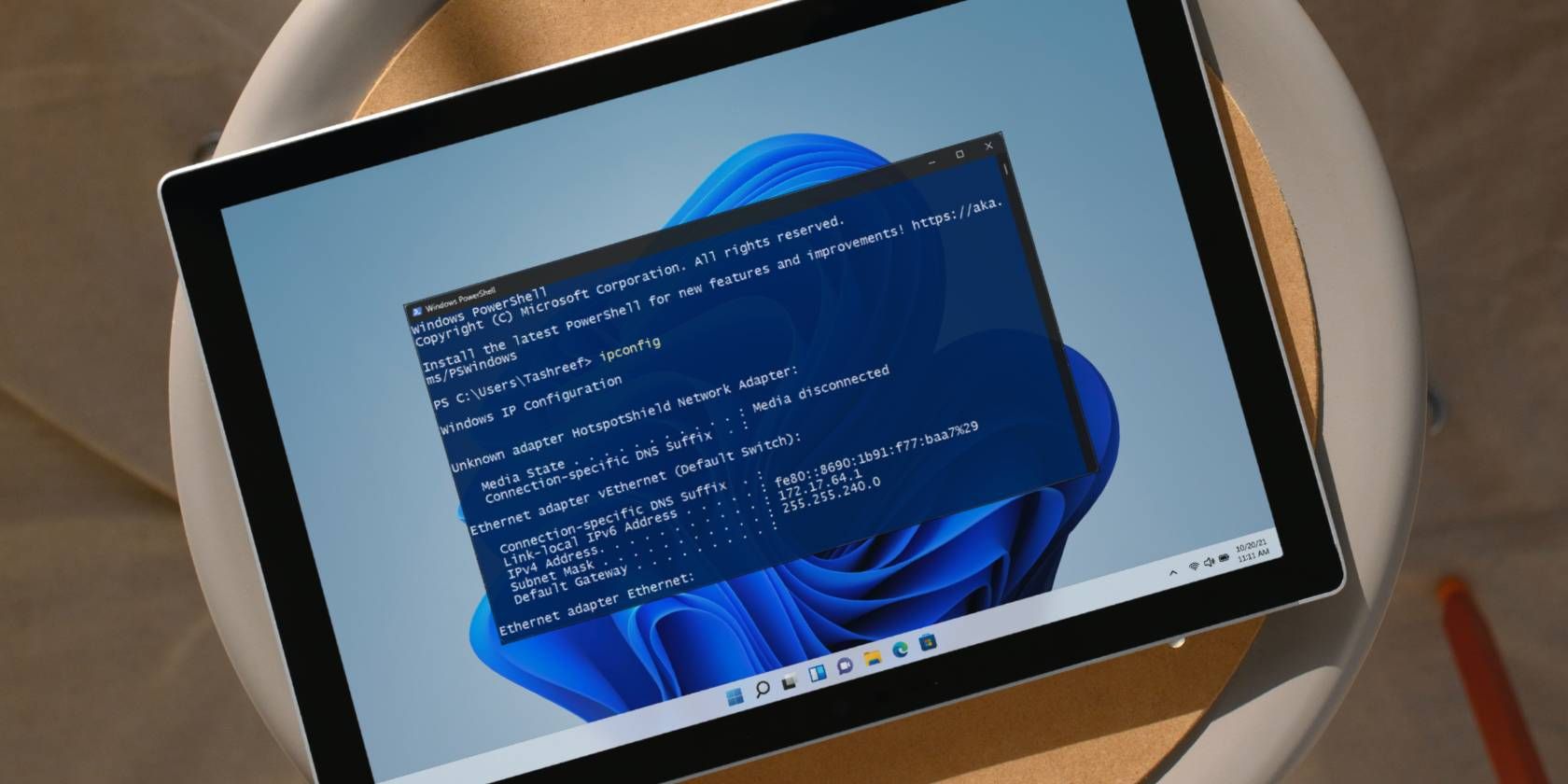 A 2-in-1 Windows computer on a surface with Command Prompt Open