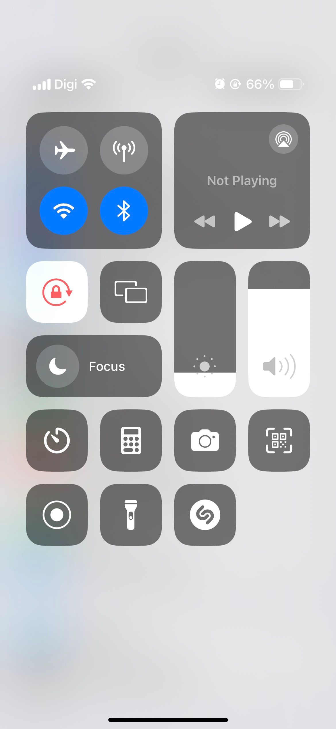 iphone control center showing lowered screen brightness