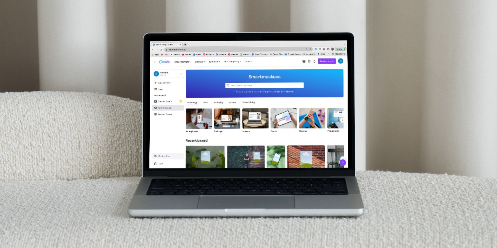 Smartmockups feature open on Canva displayed on a laptop sitting on a couch