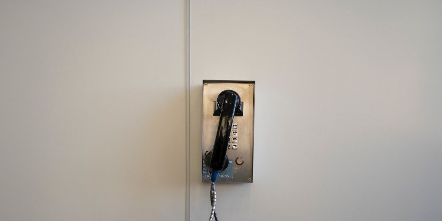 Wall pay phone on hook