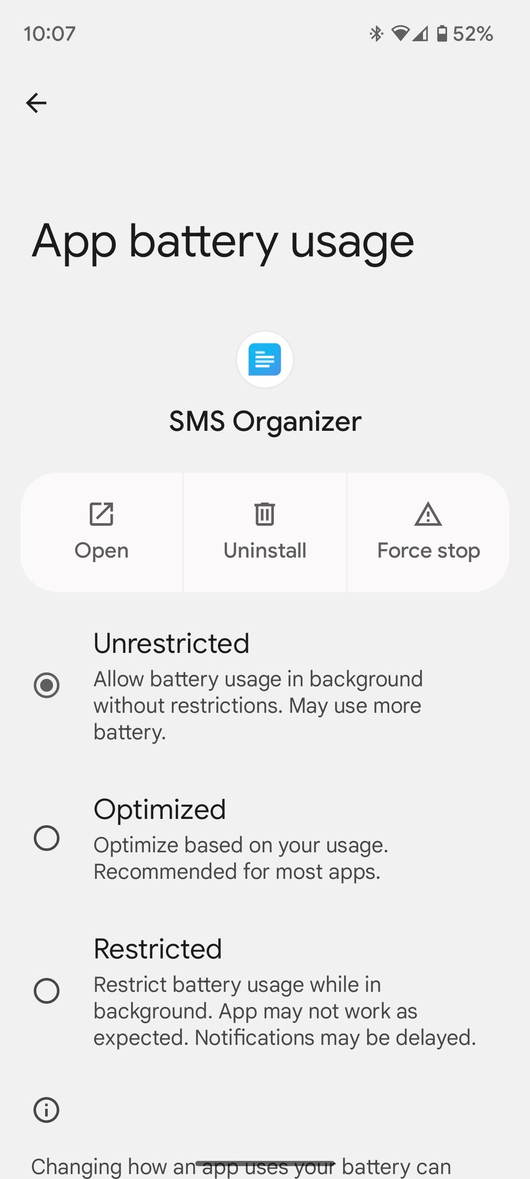 Setting an app's battery restriction to Unrestricted in the Settings app on a Pixel 7
