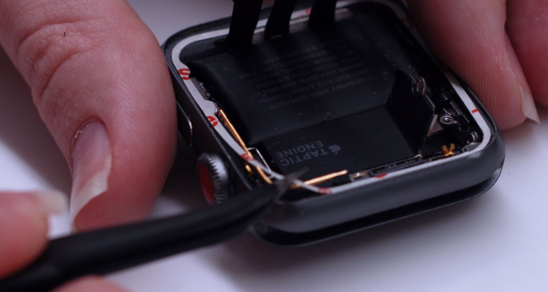 applying adhesive before installing the force touch sensor
