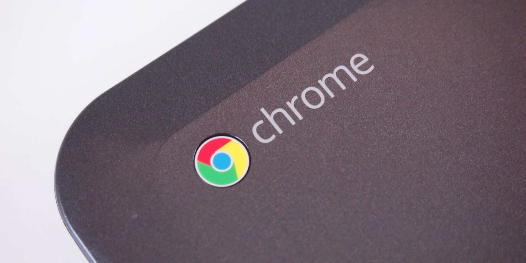 chrome logo on corner of chromebook laptop isolated