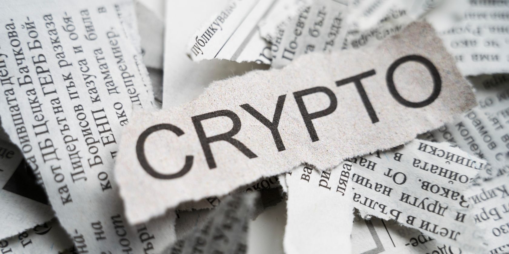 crypto written on a torn piece of newspaper