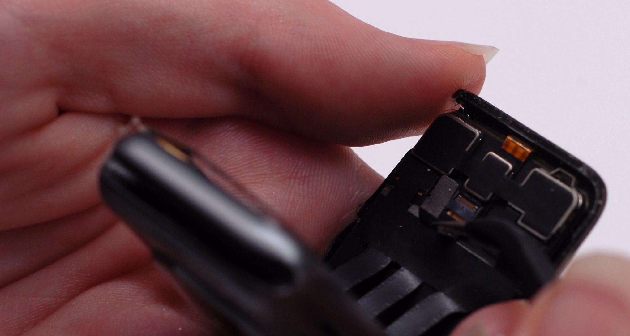 lifting the apple watch screen and revealing the display connectors