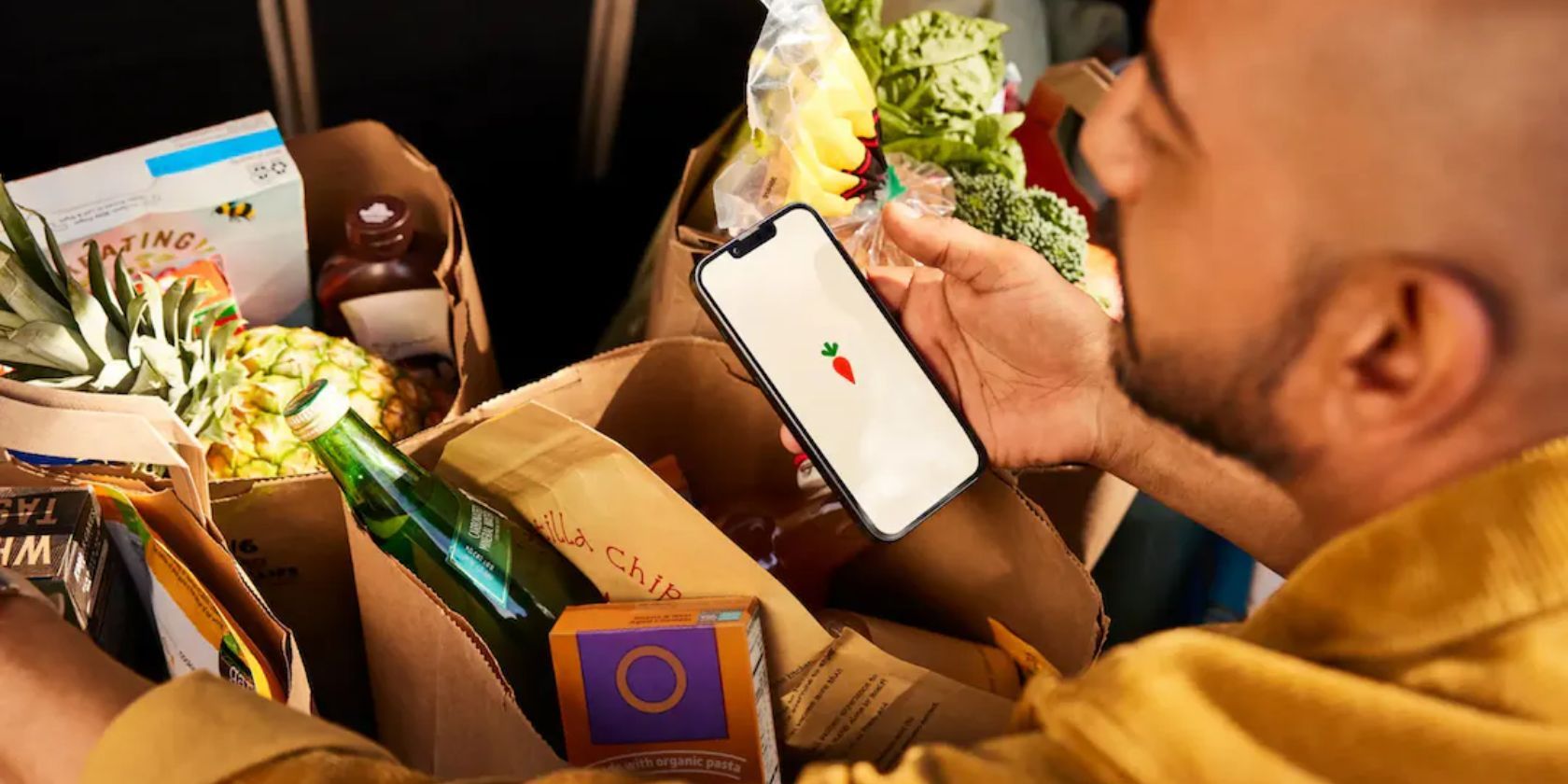 Man inspecting groceries from Instacart