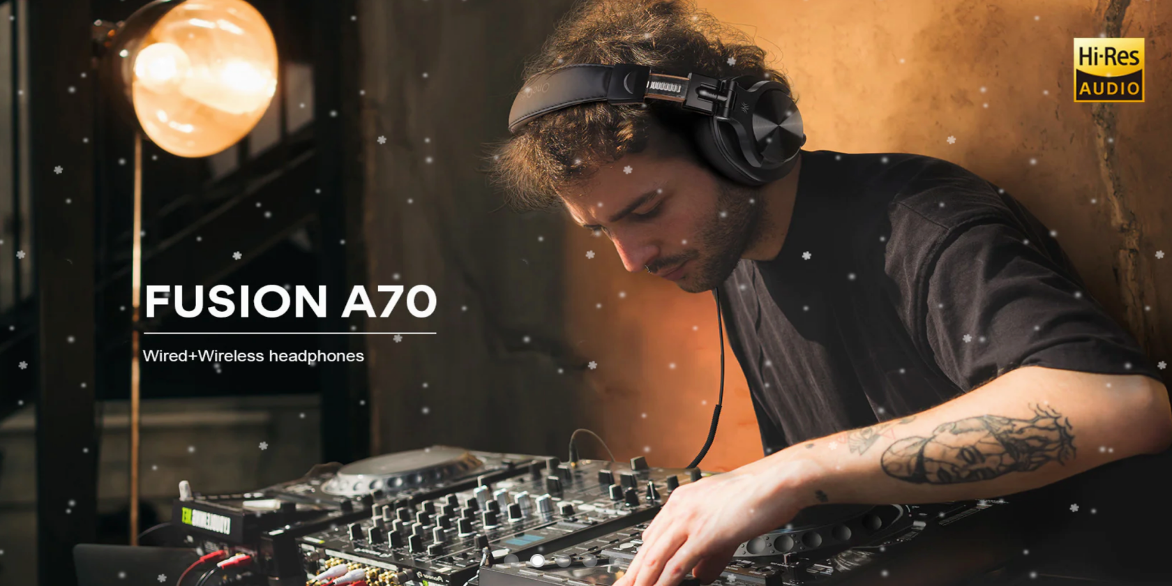 A sound engineer wearing OneOdio Fusion A70 headphones at a mixing desk.