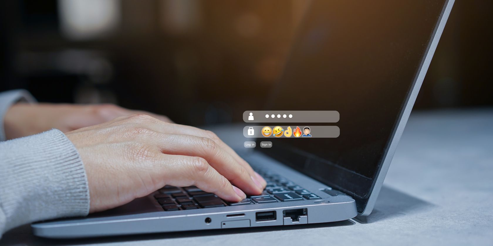 person inputting emoji password on laptop
