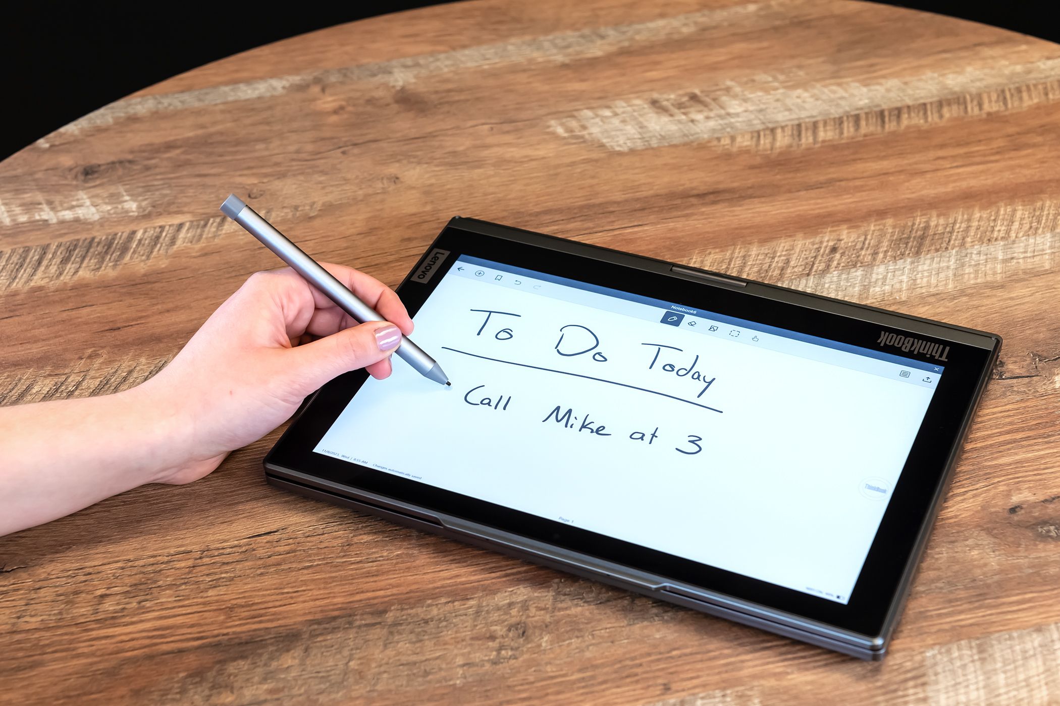 Person writing on ThinkBook Plus Gen 4 E-ink panel