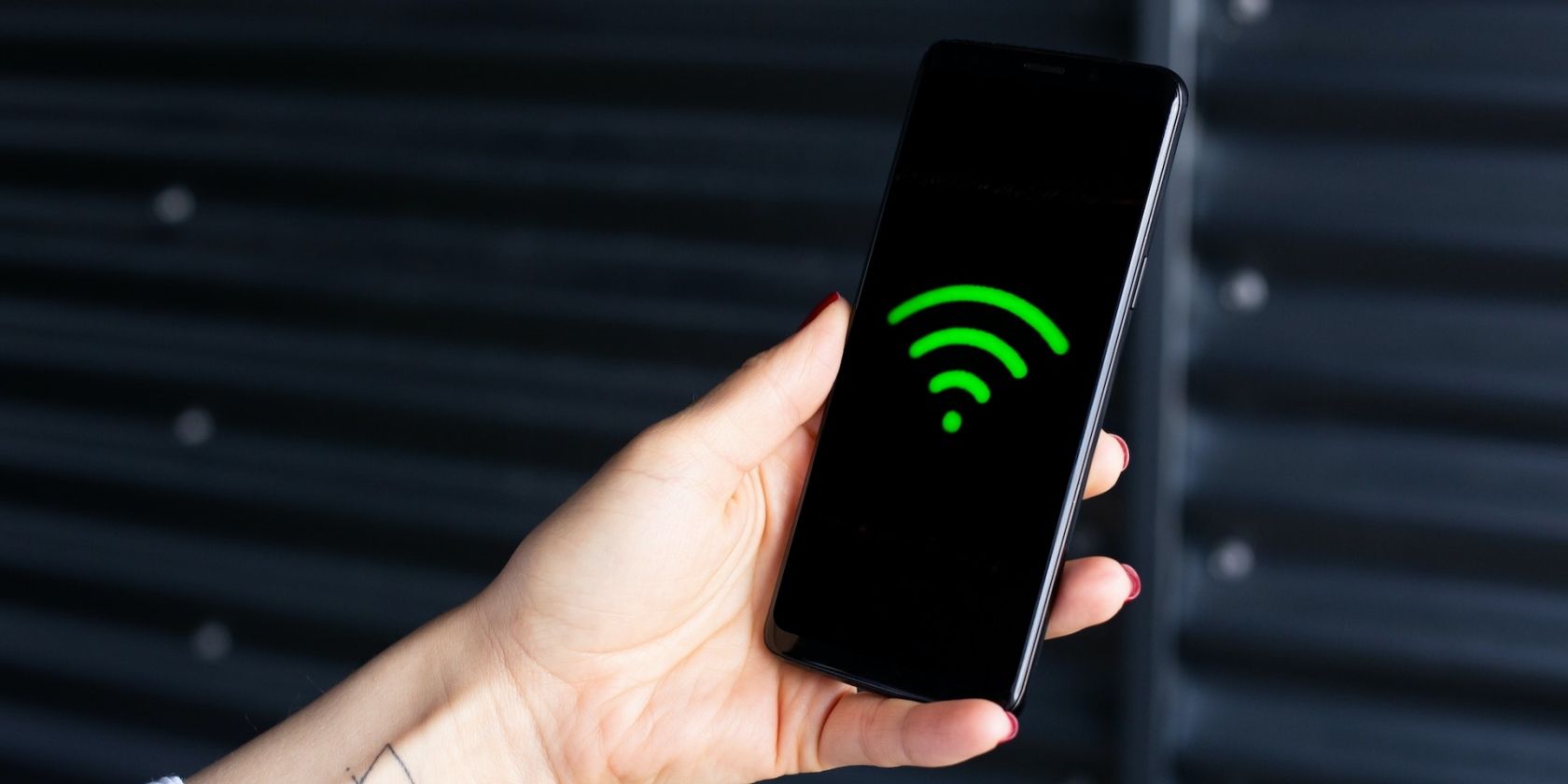 Wi-Fi symbol on a smartphone in hand