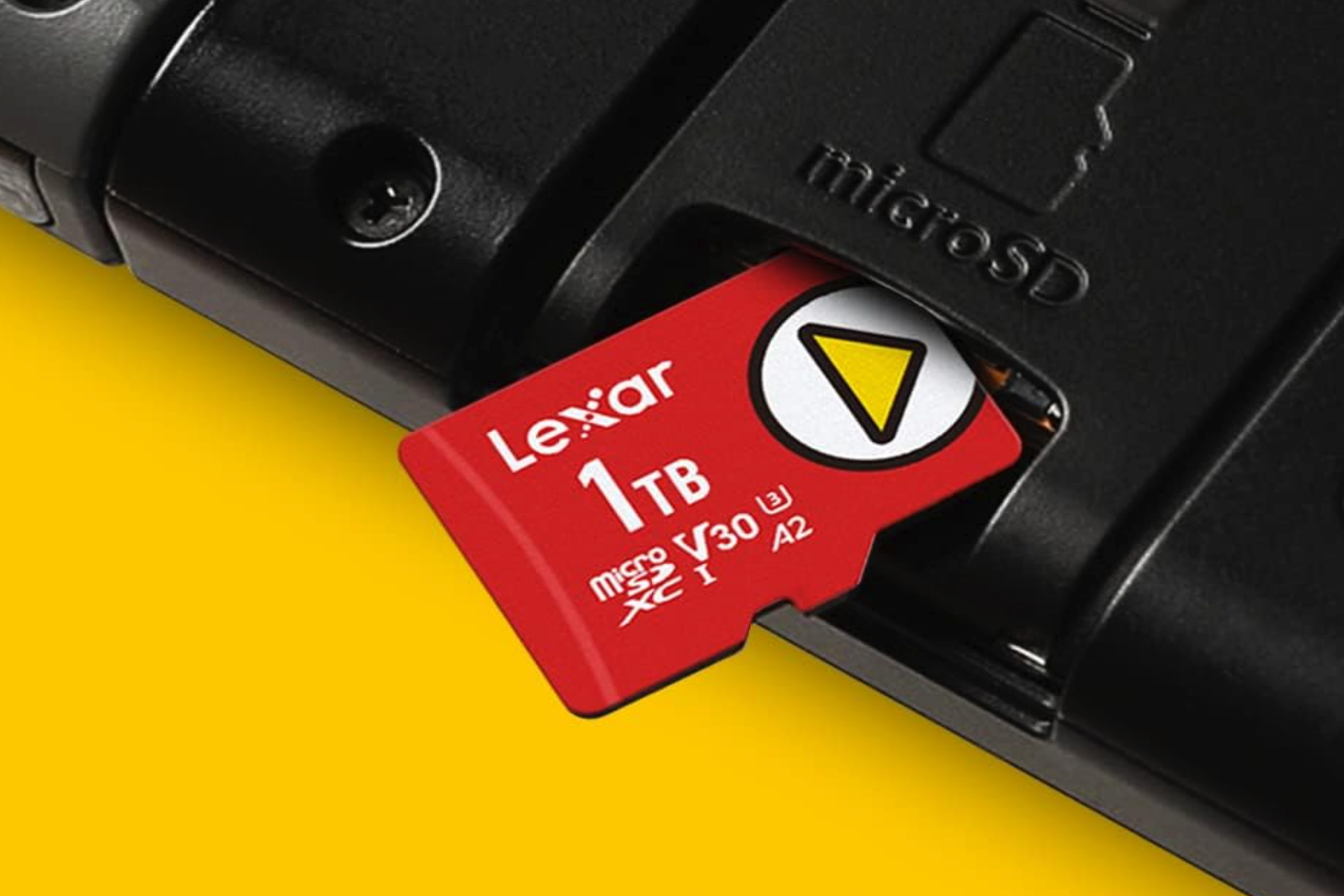 A Lexar Play 1TB microSDXC UHS-I being inserted into a microSD card slot