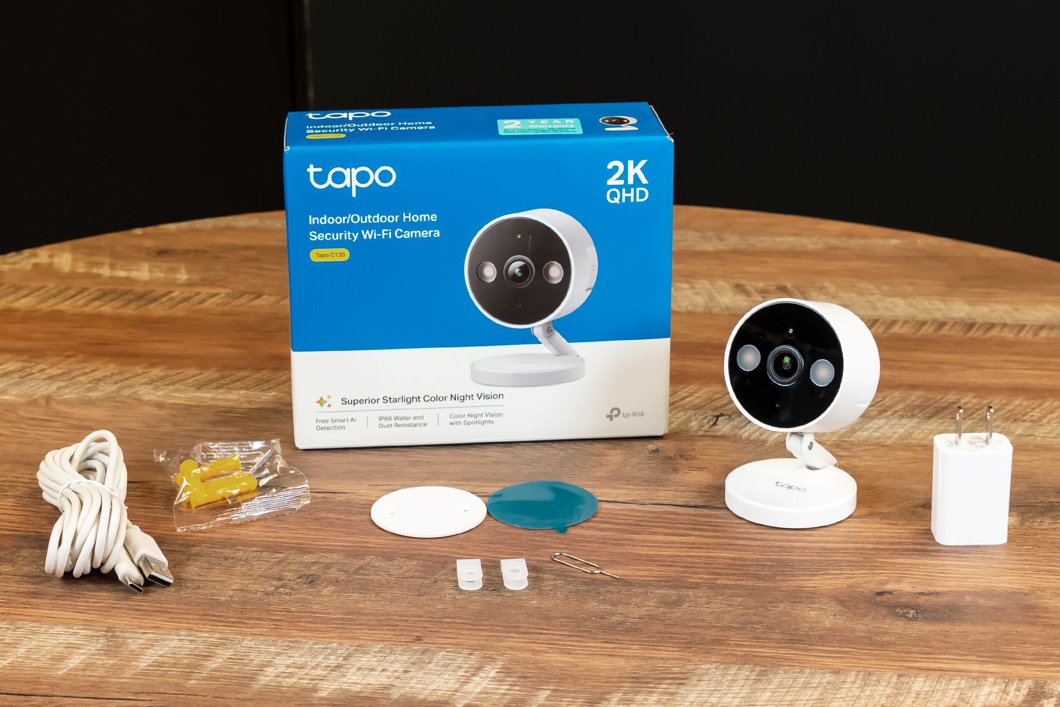 Tapo Security Camera Packaging with box, camera, charging accessories, and attachment hardware