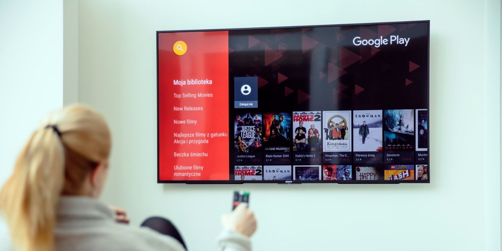 woman using google play on her android tv