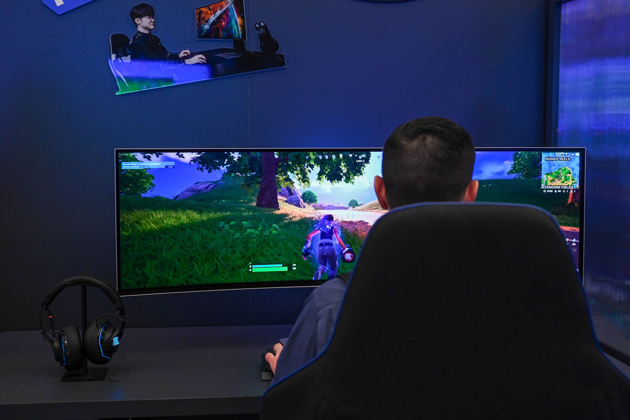 Person playing Fortnite on a Samsung Odyssey Curved Monitor at CES 2024