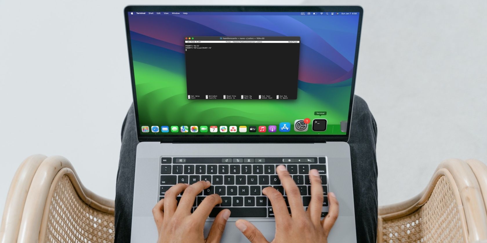 A person using Terminal on their MacBook Pro