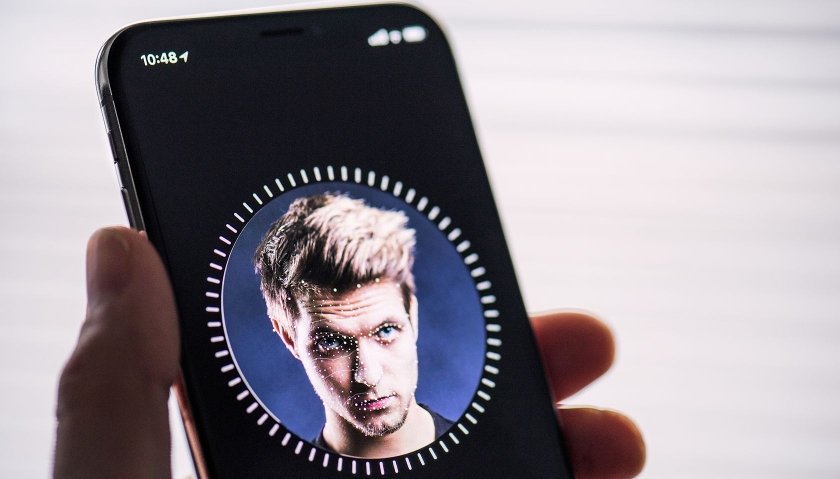 An iPhone user setting up Face ID
