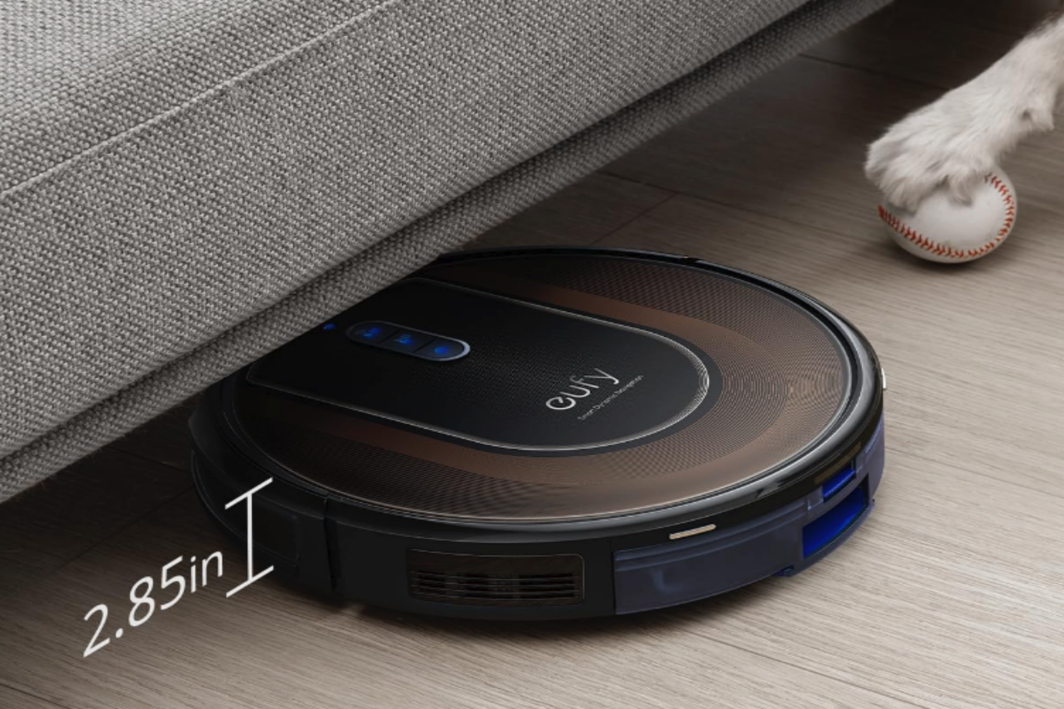 A eufy Clean by Anker RoboVac G30 Hybrid SES sliding under some furniture to clean.