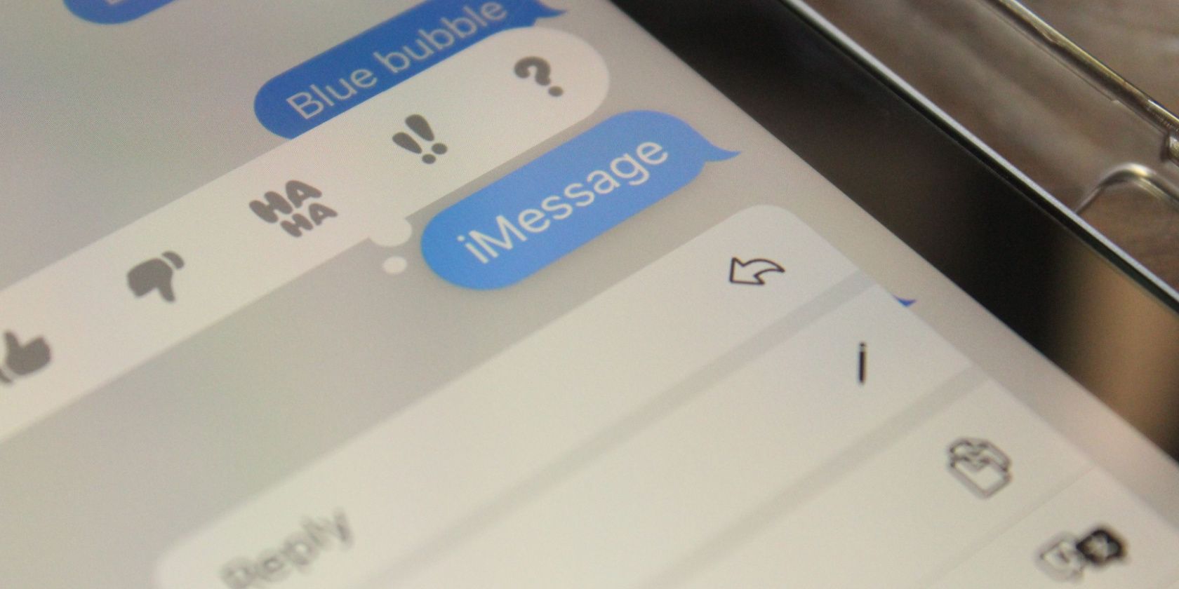 iMessage on iPhone showing blue bubbles and reactions