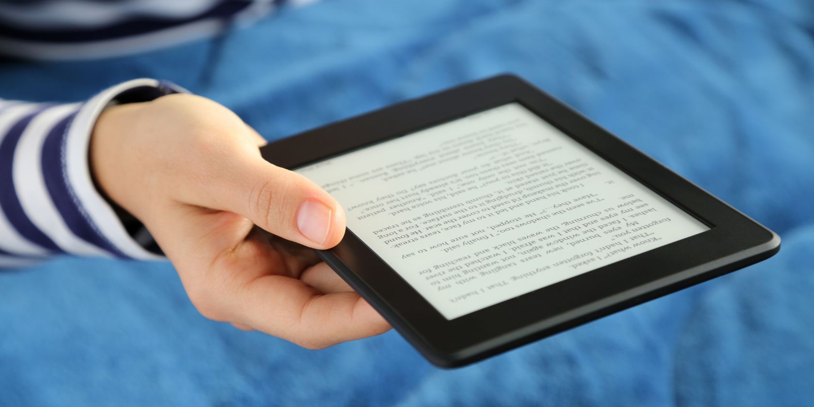 kindle ereader held in a woman's hand