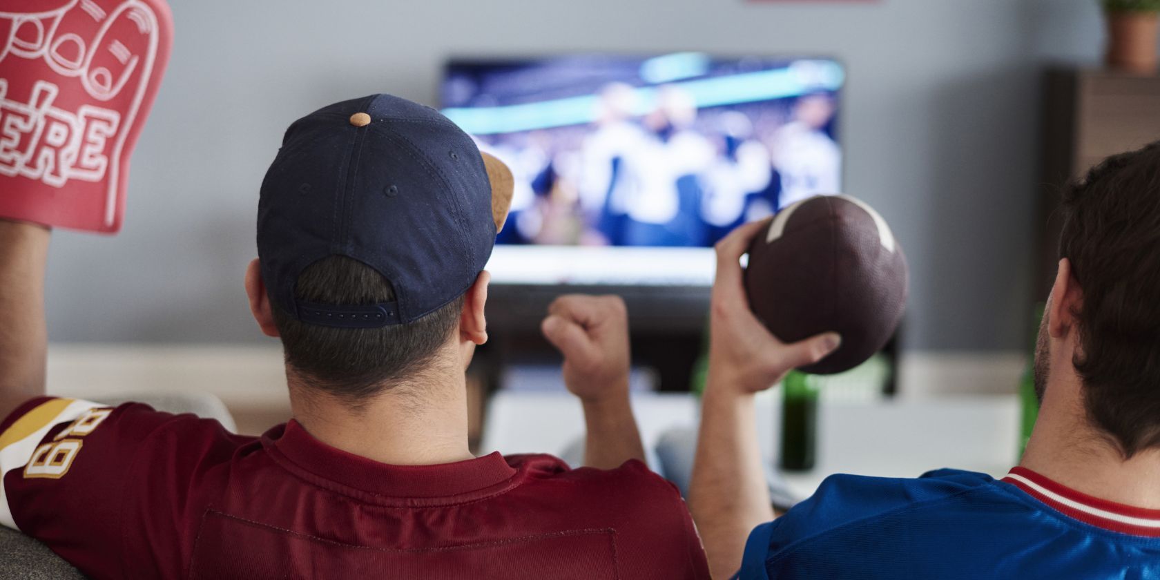 two men watching american football