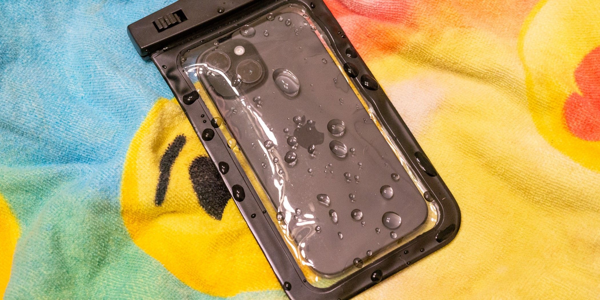 An iPhone in a waterproof pouch