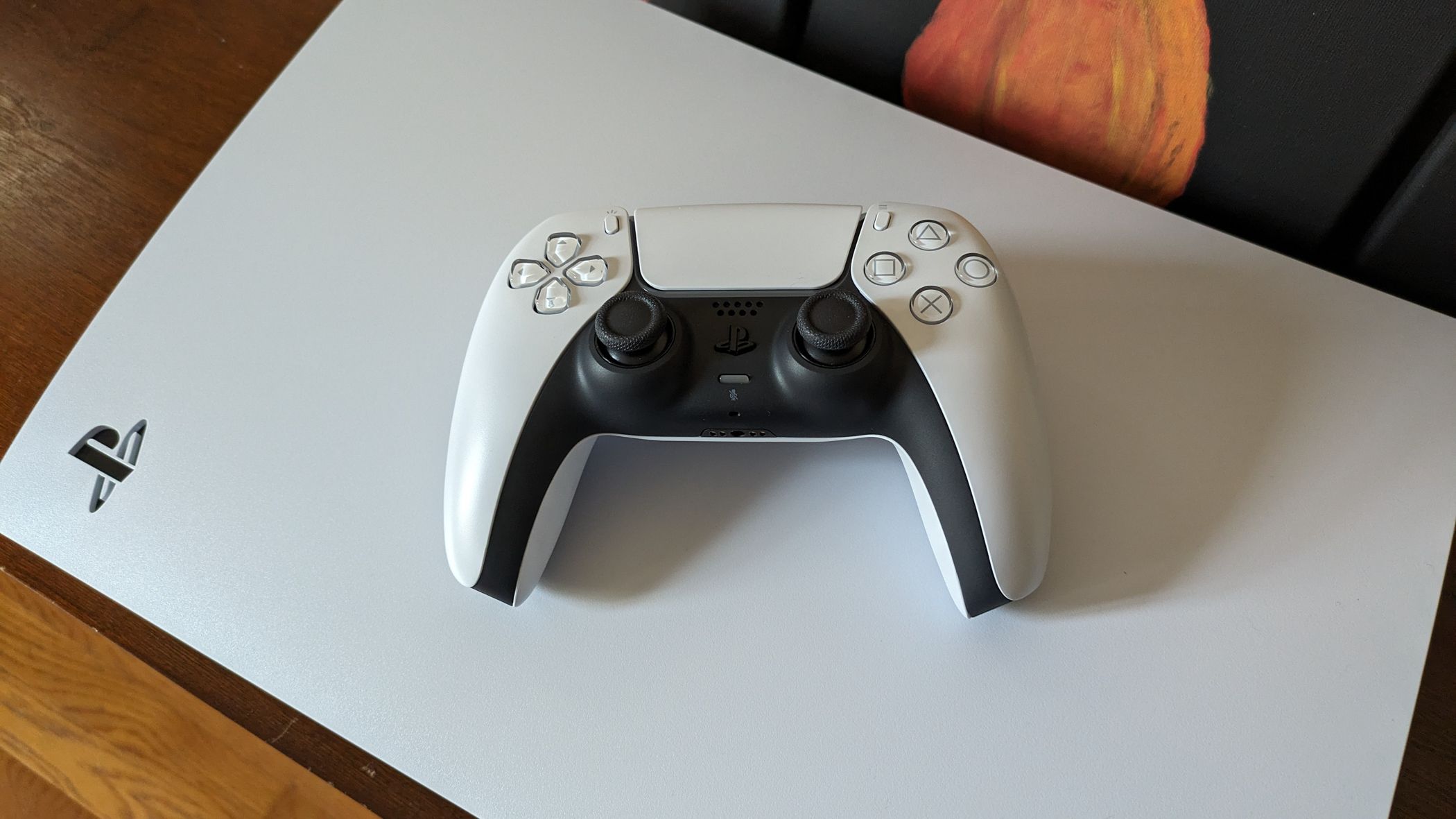 A Dualsense controller on top of the PS5