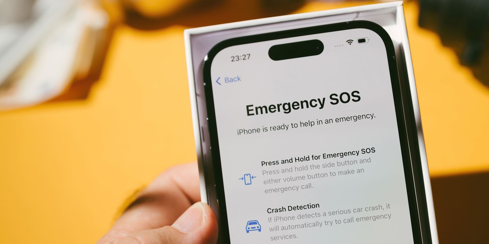 A brief introduction to the Emergency SOS feature shown on an iPhone 14 Pro
