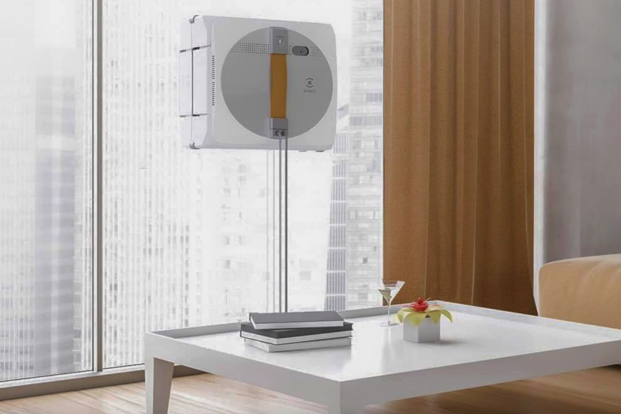 An ECOVACS Winbot W1 Pro Window Cleaning Robot cleaning a living-room window