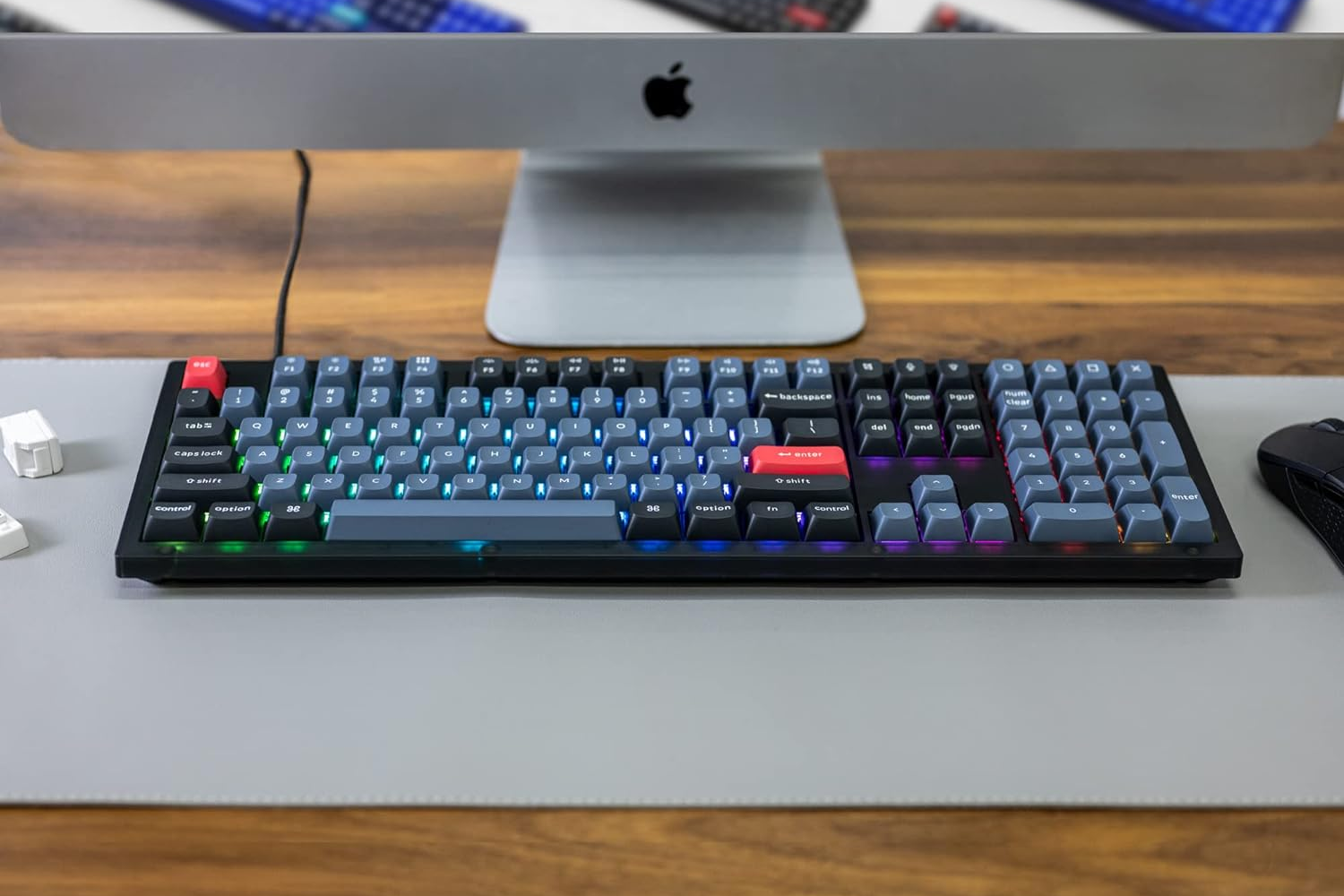 Keychron V6 Wired Custom Mechanical Keyboard on a desk, in front of an apple imac
