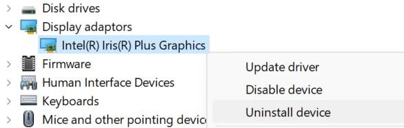Uninstalling a graphics driver in Device Manager.