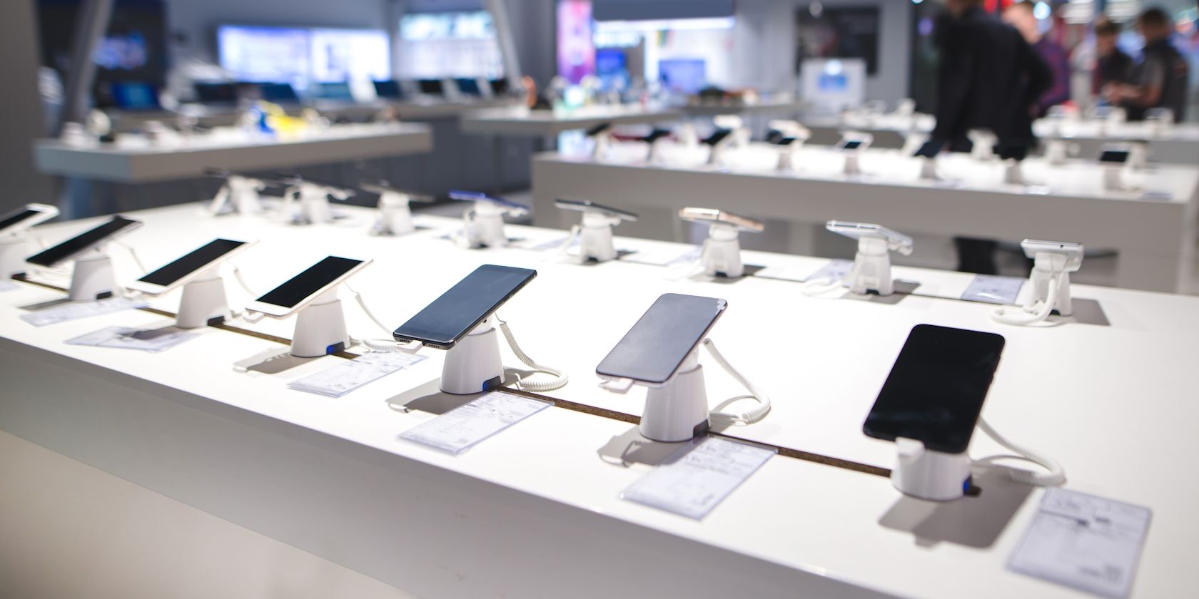 Various smartphones displayed in a store