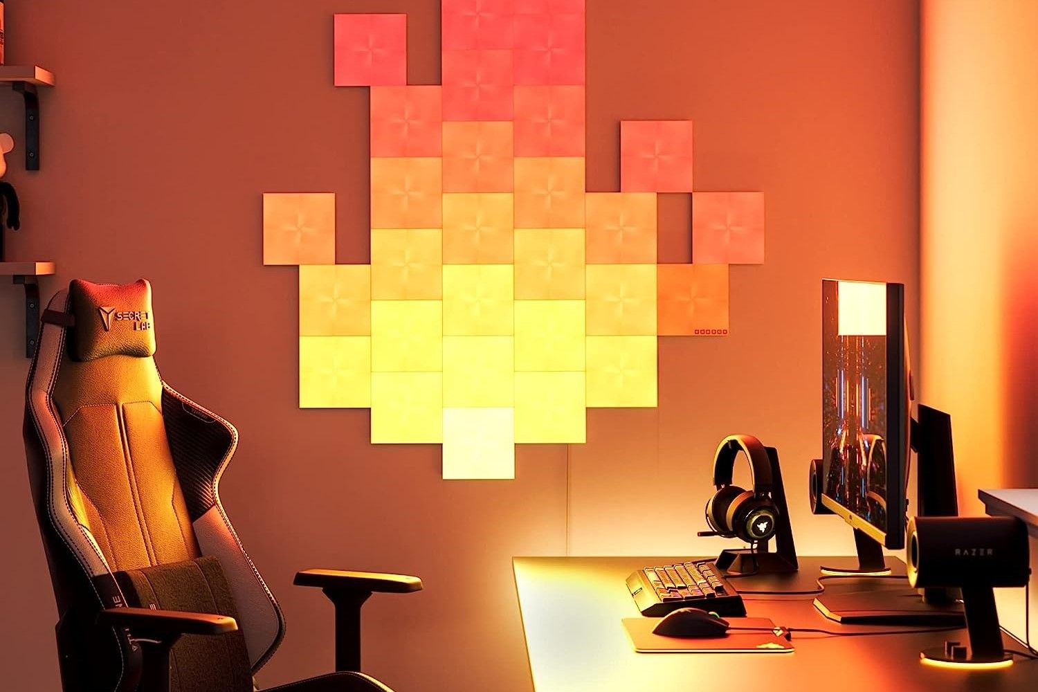 Nanoleaf Canvas on a wall next to a gaming PC
