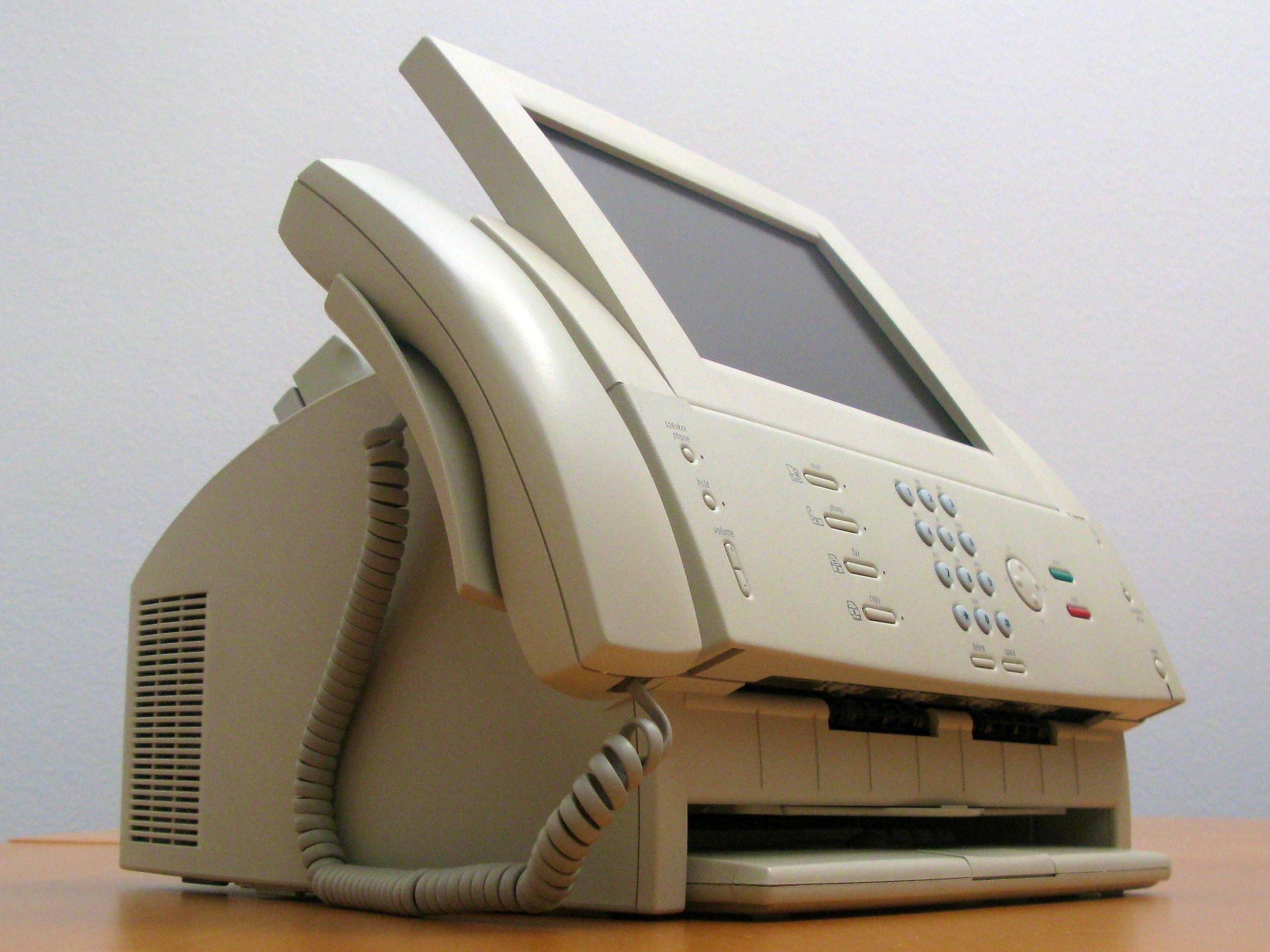 An image of the Apple Paladin computer, fax machine, and telephone