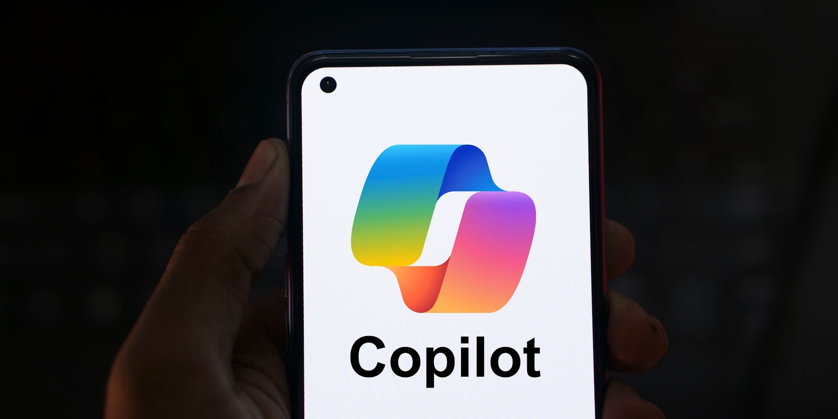 Man holding an Android phone with the Copilot app open