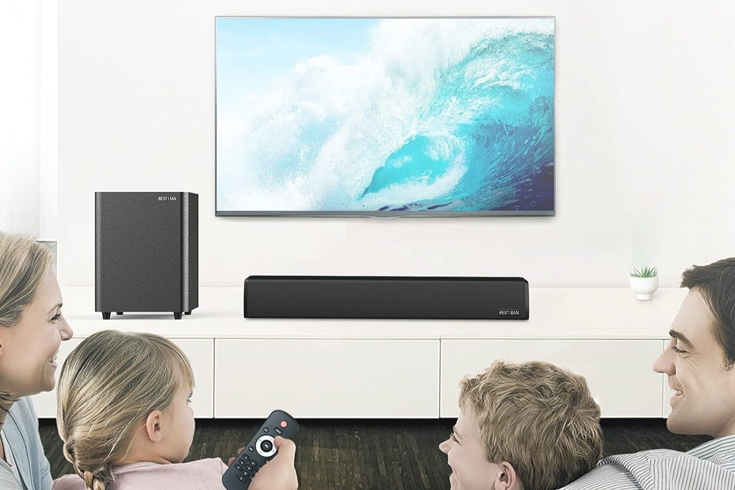 Bestisan subwoofer on a TV stand next to a sound bar and TV