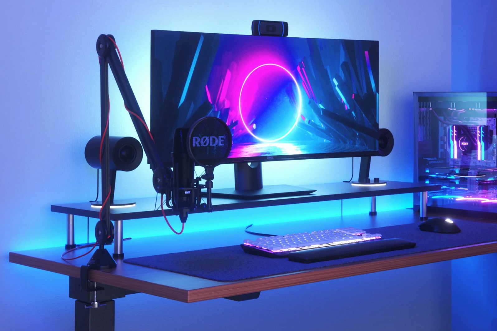 a gaming desk is illuminated by a nanoleaf essentials lightstrip