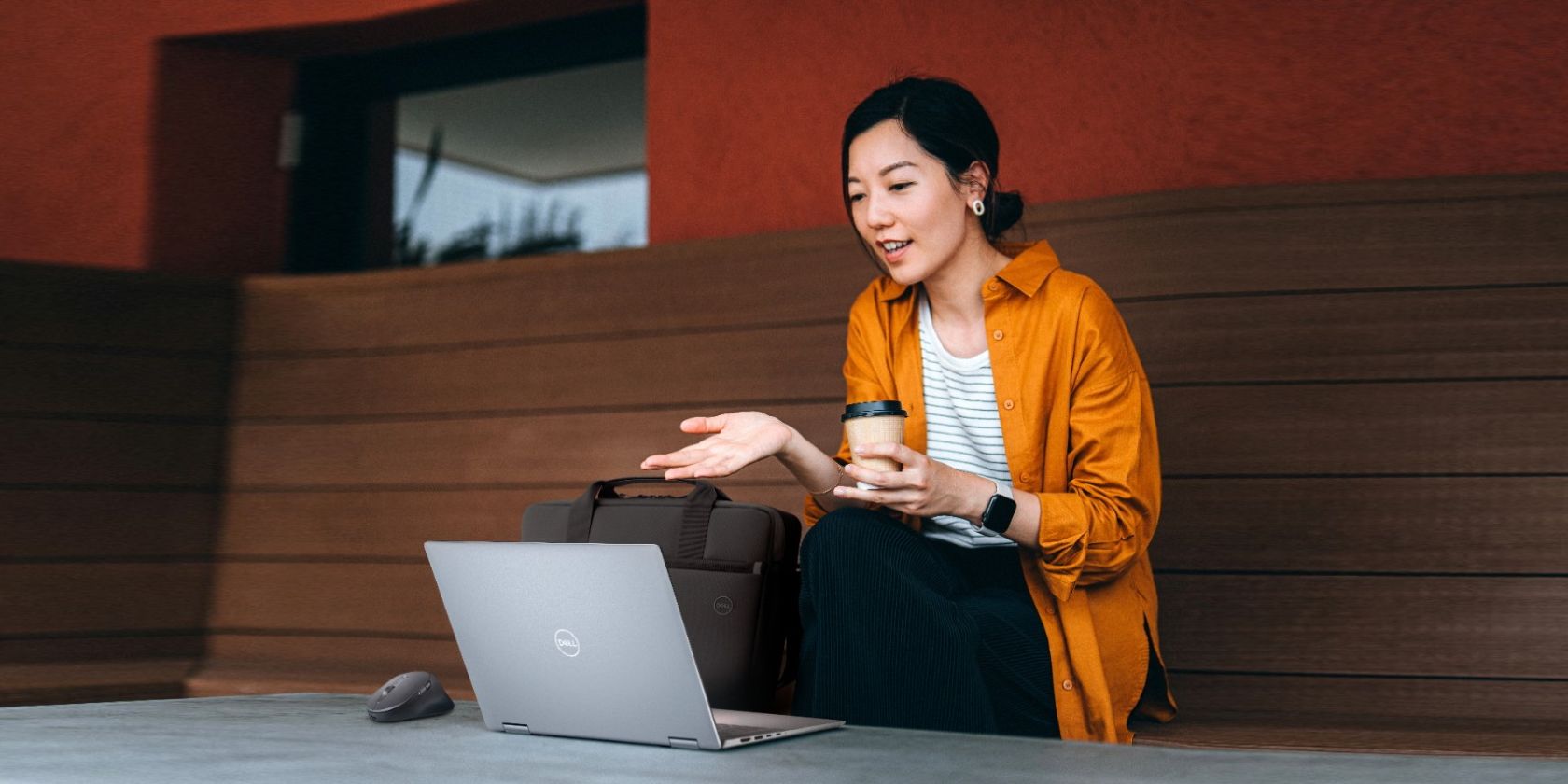 Woman with Coffee on Dell Laptop Outside