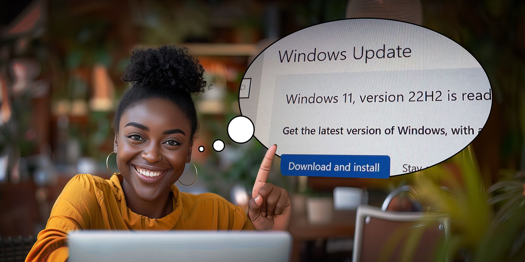 A cheerful woman points to a laptop screen displaying a prompt to download and install Windows 11