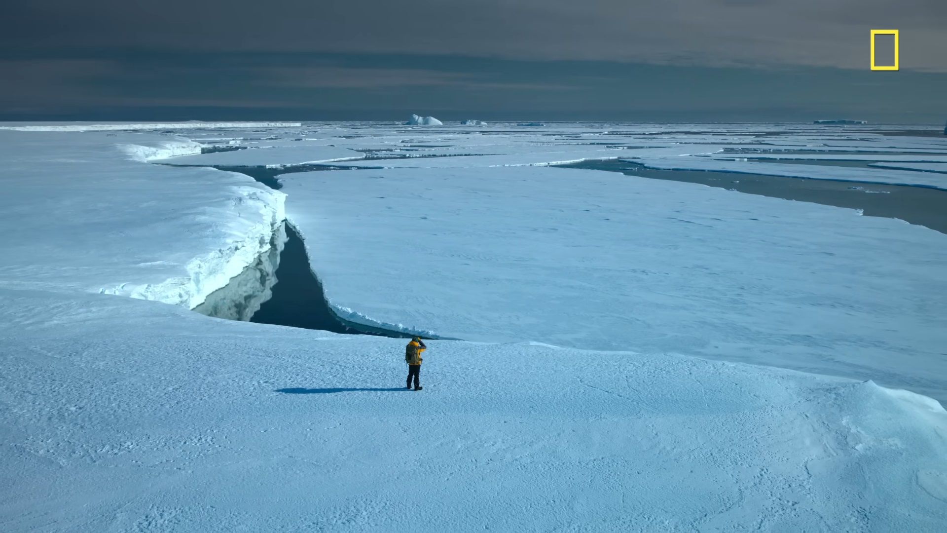 national geograpic screenshot man standing on glacier